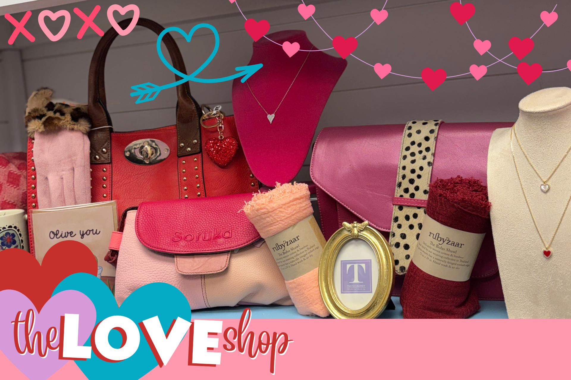 Valentine's Day themed products including a red handbag, pink pouch, and jewelry on a pink background with decorative hearts and 'The LOVE Shop' branding.